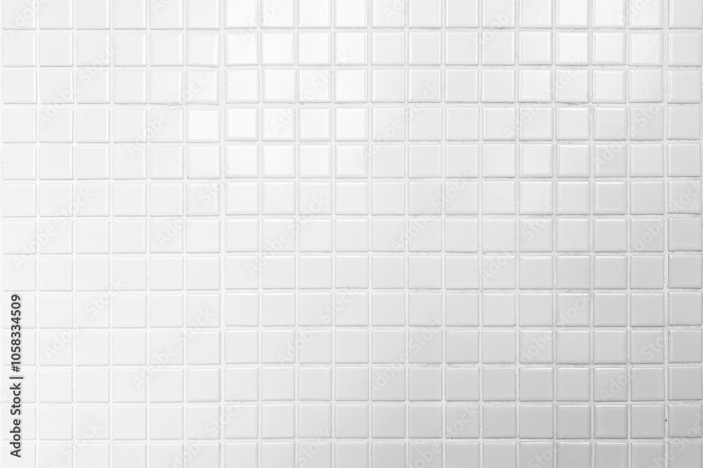 White Mosaic Tiles Toilet Wall with Light Leak from the Top. White Mosaic Tiles Toilet Wall with Light Leak from the Top.