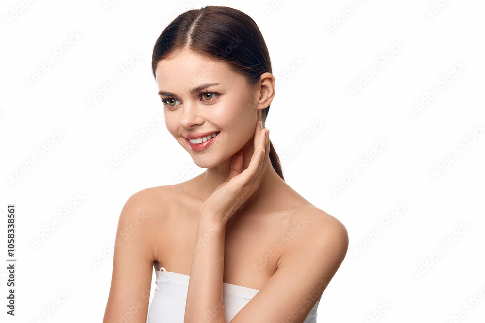 Beautiful young woman with hands on face posing on white background Beautiful young woman with hands on face posing on white background