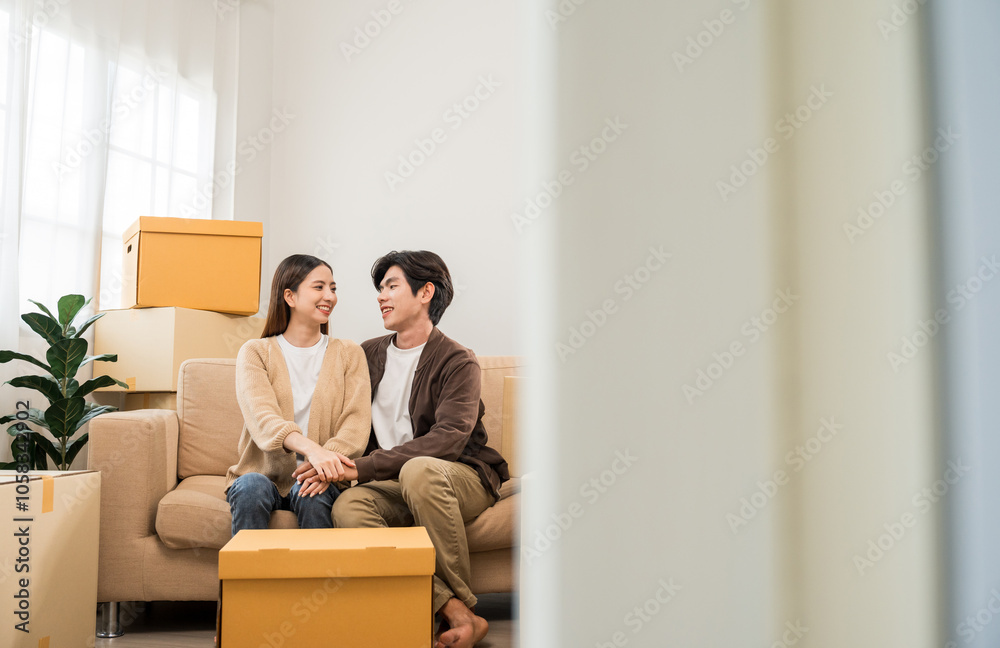 Couple asian family buying new house. Happy moment man and woman getting new home moving parcels into the house and decorate Moving relocation with lot of parcel box cardboard Couple asian family buying new house. Happy moment man and woman getting new home moving parcels into the house and decorate Moving relocation with lot of parcel box cardboard