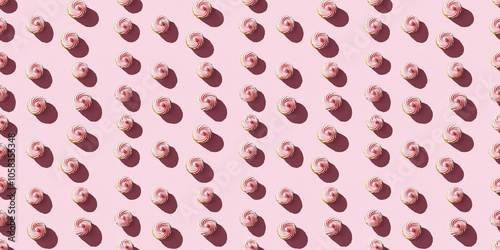 A seamless pattern of cupcakes, each with its shadow, scattered across the canvas in an elegant display, with soft shadows on a soft pale pink color background