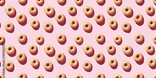 A seamless pattern of donuts, each with its shadow, scattered across the canvas in an elegant display, with soft shadows on a soft pale pink color background