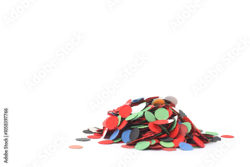 Colorful paper confetti red, black, green, white, blue closed up on white background