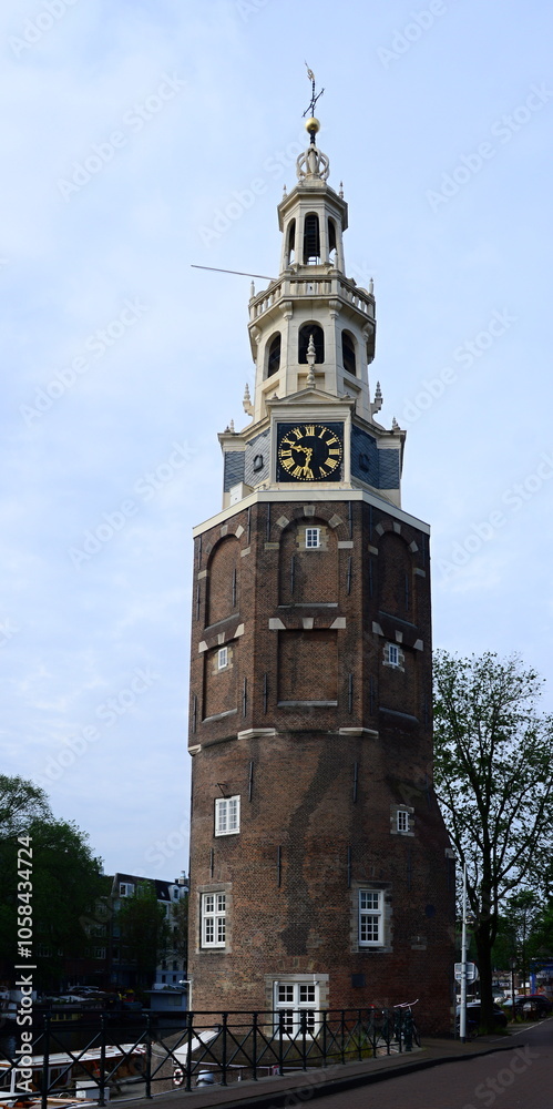Historical Tower Montelbaanstoren in the Old Town of Amsterdan, Netherlands Historical Tower Montelbaanstoren in the Old Town of Amsterdan, Netherlands