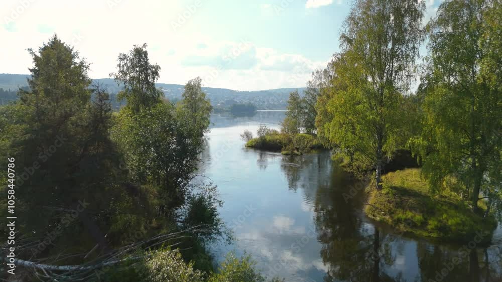 Aerial dolly over calm Glomma River with islands and lush trees, Norway Aerial dolly over calm Glomma River with islands and lush trees, Norway