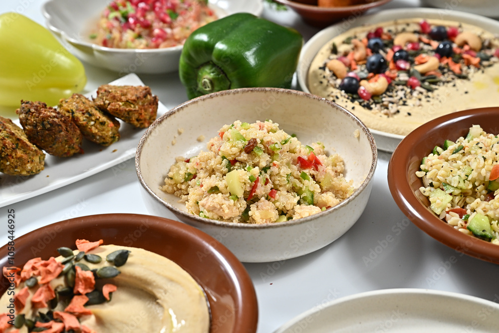 a variety of food dishes are laid out on a table a variety of food dishes are laid out on a table