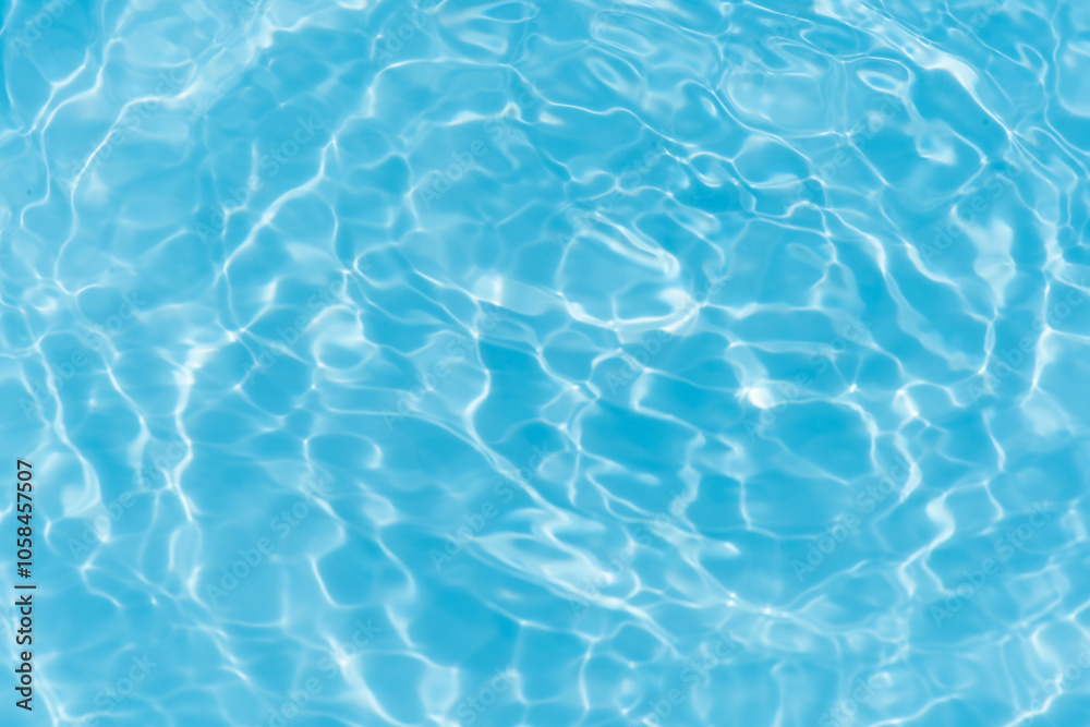 Blue water with ripples on the surface. Defocus blurred transparent blue colored clear calm water surface texture with splashes and bubbles. Water waves with shining pattern texture background. Blue water with ripples on the surface. Defocus blurred transparent blue colored clear calm water surface texture with splashes and bubbles. Water waves with shining pattern texture background.