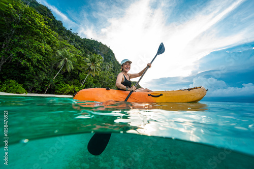 Wallpaper Mural enjoying kayaking on calm water in Raja Ampat / Indonesia Torontodigital.ca
