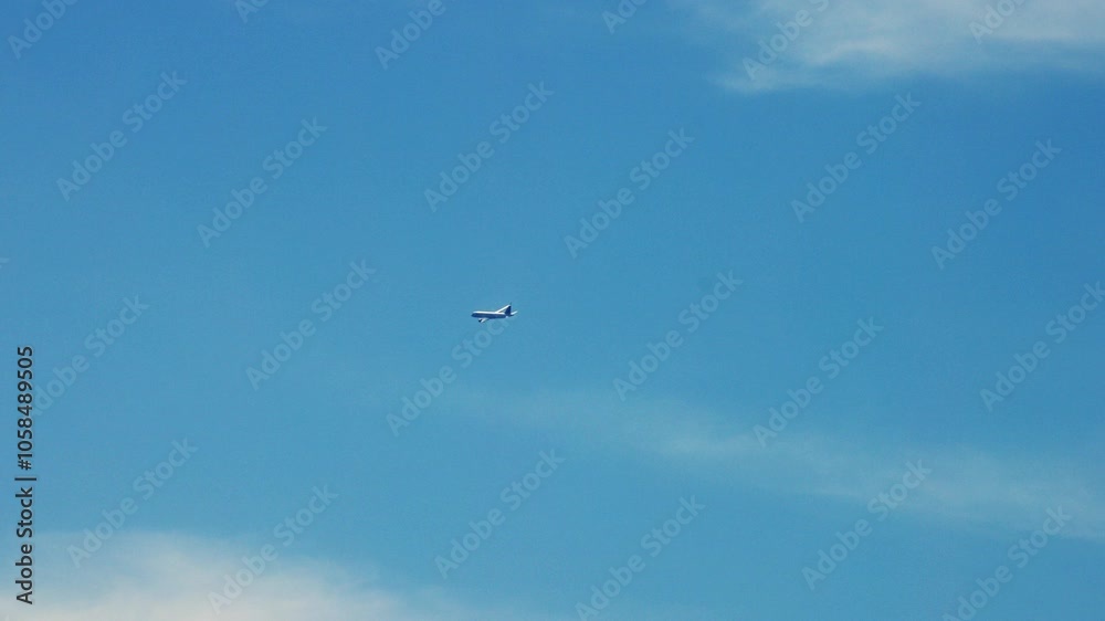 A plane glides across a bright blue sky, symbolizing the excitement of air travel. This scene embodies adventure and freedom, perfect for themes of journey and escape. A plane glides across a bright blue sky, symbolizing the excitement of air travel. This scene embodies adventure and freedom, perfect for themes of journey and escape.