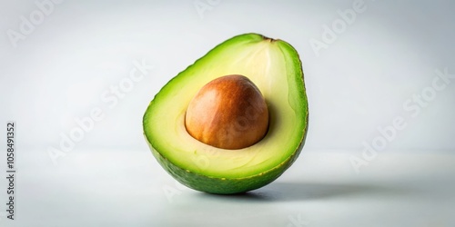 A Close-Up View of a Half Avocado with its Seed Intact, Revealing the Smooth, Creamy Green Flesh and a Delicate Layer of Skin
