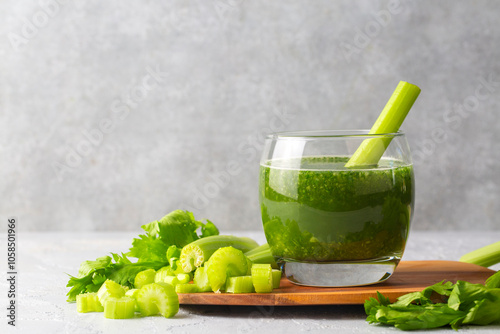 A glass of green celery juice. Celery drink prepared for healthy nutrition and detox - Celery smoothie