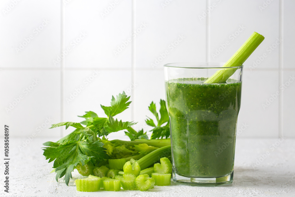 A glass of green celery juice. Celery drink prepared for healthy nutrition and detox - Celery smoothie