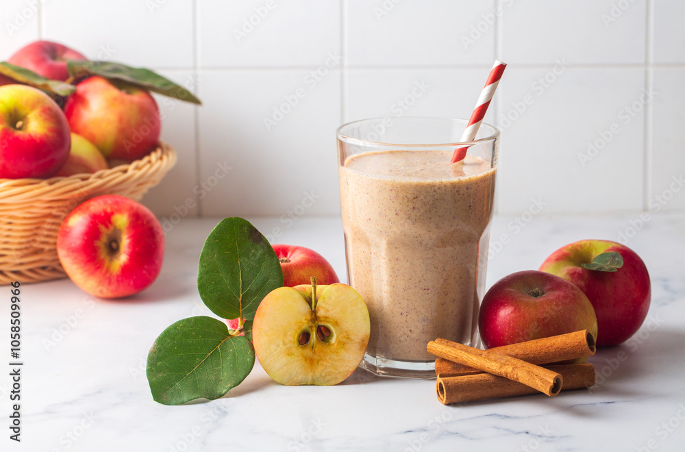A delicious glass of apple smoothie or apple juice with fresh apple fruits