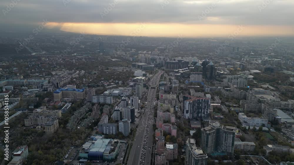 View of the city, with different buildings and streets. Sunset time. Autumn. The view from the drone. View of the city, with different buildings and streets. Sunset time. Autumn. The view from the drone.