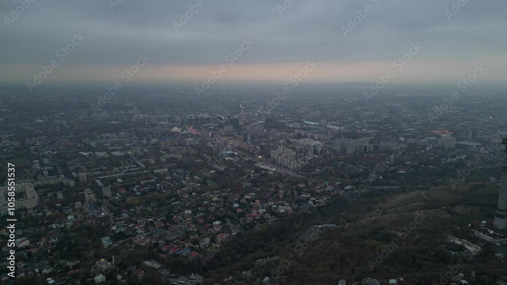 View of the city, with different buildings and streets. Sunset time. Autumn. The view from the drone. View of the city, with different buildings and streets. Sunset time. Autumn. The view from the drone.