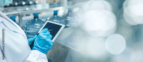 Obraz na płótnie Closeup hygiene worker work with tablet software management technology for manage production in modern factory with space for text w salonie