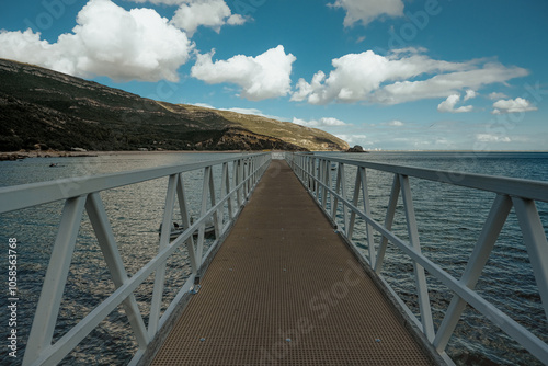 Pier surrounded. Portinho da Arrabida beach in setubal portugal. photo