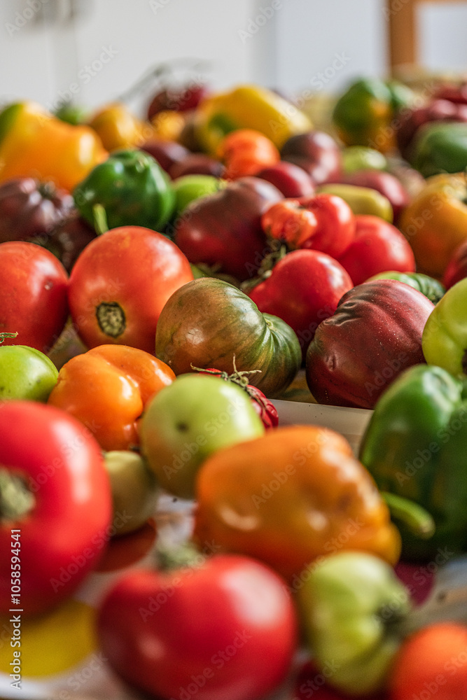 Colourful assortment of tomatoes and peppers on a table. Colourful assortment of tomatoes and peppers on a table.