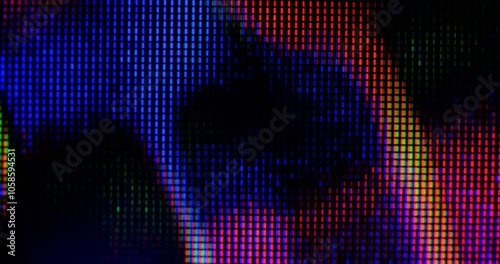 macro view of 4K LED matrix red, blue, and green sub-pixels, monitor, or TV screen. Colored pixels texture creates an abstract pattern.