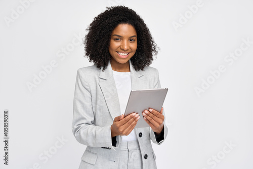 Wallpaper Mural Happy young African American business woman holding digital tablet standing isolated on white background, smiling busy sales professional ethnic lady corporate leader working on pad device. Portrait. Torontodigital.ca