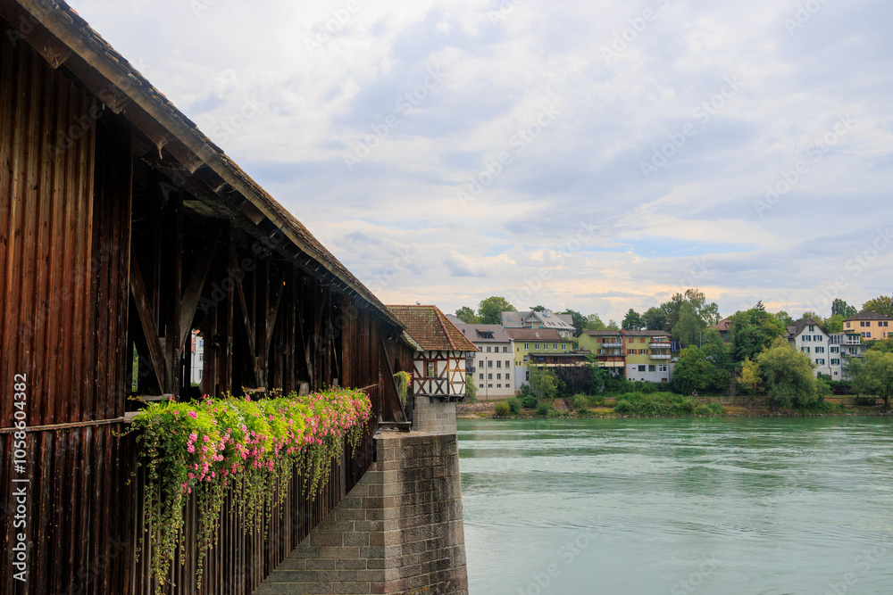 Fototapeta premium The historic old wooden bridge between Germany and Switzerland over the Rhine at Bad Säckingen