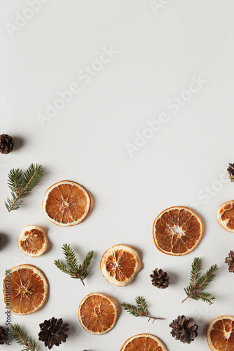 Natural organic composition with dried oranges, cones and fir twigs. Holidays concept, natural background.