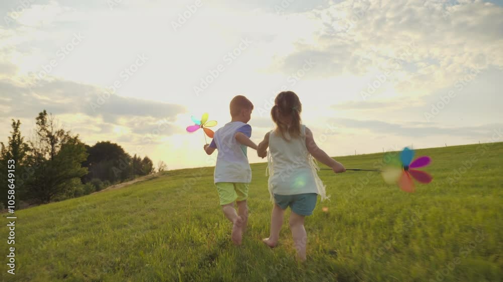 Two children run across a green meadow, holding hands under a sunny sky with a bright pinwheel in hand, filling the scene with happy emotions Two children run across a green meadow, holding hands under a sunny sky with a bright pinwheel in hand, filling the scene with happy emotions