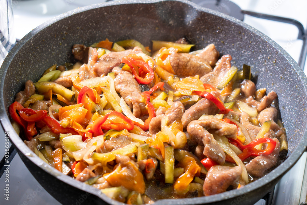 Beef with vegetables in soy sauce. onion, carrot, bell pepper. Food concept. Chinese food Beef with vegetables in soy sauce. onion, carrot, bell pepper. Food concept. Chinese food