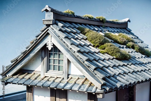 A weathered wooden teahouse with moss-covered roof tiles and cracks that enhance its beauty. 