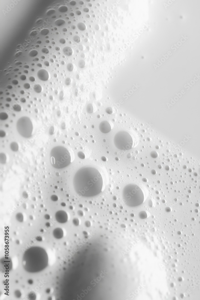 © vefimov - Droplets visible on the surface of a bottled milk beverage. © vefimov - Droplets visible on the surface of a bottled milk beverage.