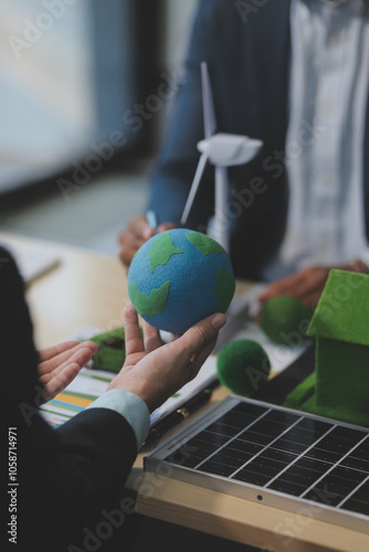 Green energy business company meeting with business people planning and discuss marketing of sustainable and renewable clean energy product with solar cell and wind turbine generator. Trailblazing