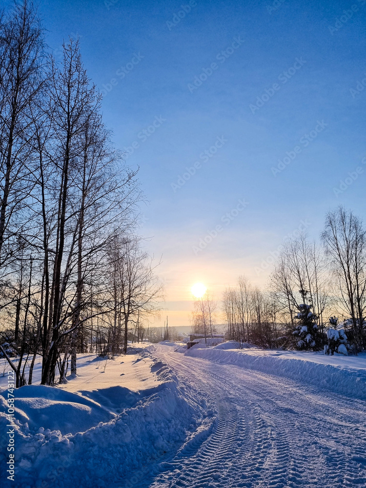 winter sunny weather, tire tracks in the snow, winter empty road goes beyond the horizon into the distance, snow-covered path, winter landscape winter sunny weather, tire tracks in the snow, winter empty road goes beyond the horizon into the distance, snow-covered path, winter landscape
