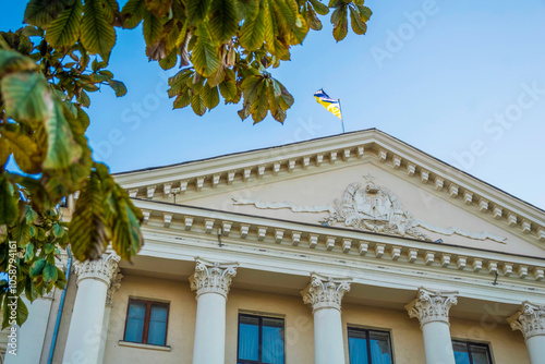 Town hall building with Ukrainian flag in Zaporizhia, Ukraine photo