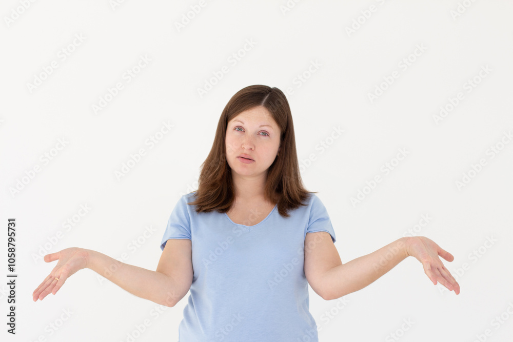 Confused thoughtful confused young woman holding copy space on palm over white background Confused thoughtful confused young woman holding copy space on palm over white background