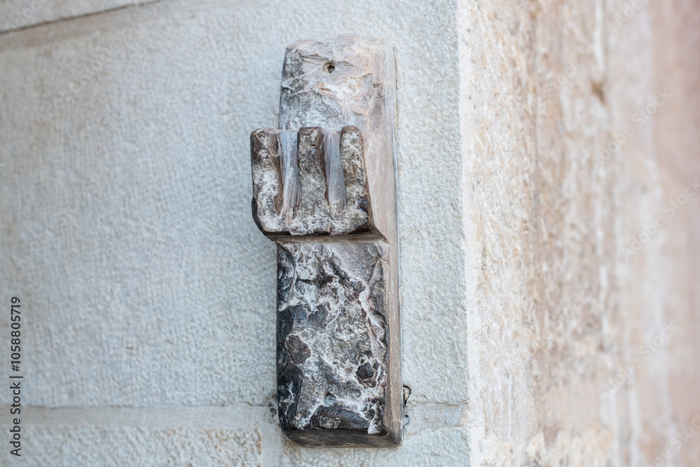 A mezuzah made from stone affixed to the outside entrance to a home in Jerusalem. A mezuzah made from stone affixed to the outside entrance to a home in Jerusalem.