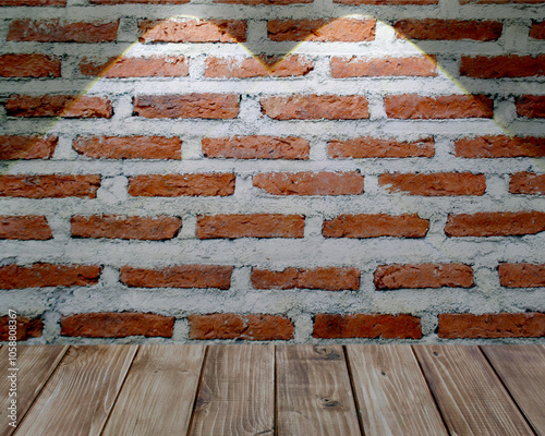 light beam shines on wood floor and brick wall