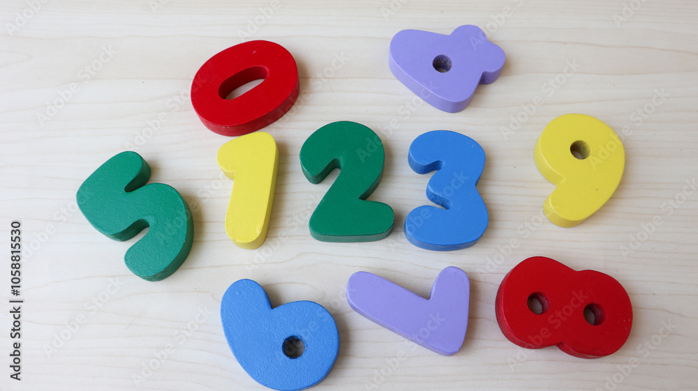 Naklejka premium 0, 1, 2, 3, 4, 5, 6, 7, 8, 9 numeral alphabet. digits from wooden material, colorful toys for kids. font for logo, Poster. number wooden puzzle