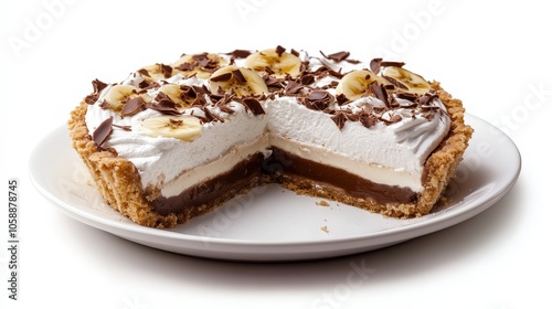 Delicious chocolate banana cream pie with whipped topping and chocolate shavings on white plate