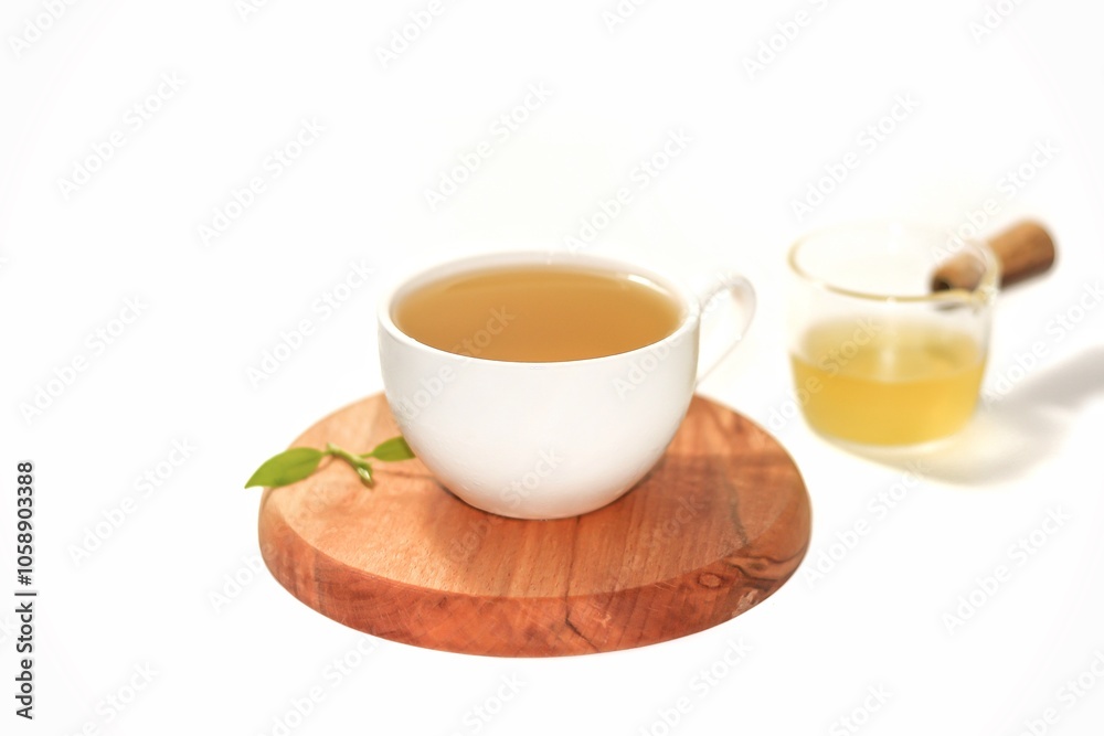 Isolation photos concept with tea water serving on wooden plates in white background. Isolation photos concept with tea water serving on wooden plates in white background.