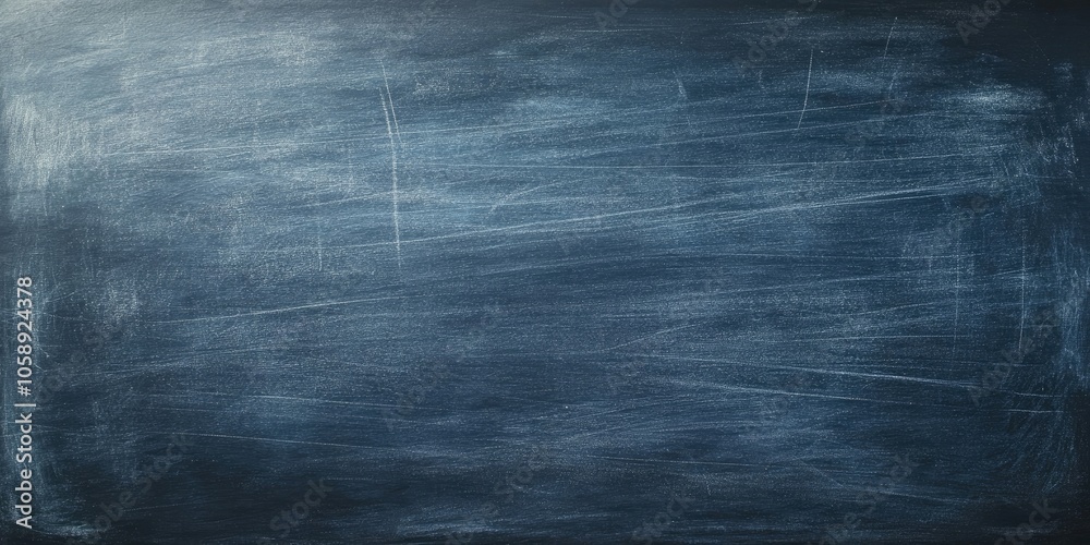 A dark, textured chalkboard surface serves as a background, representing a blank blackboard ideal for writing or drawing.