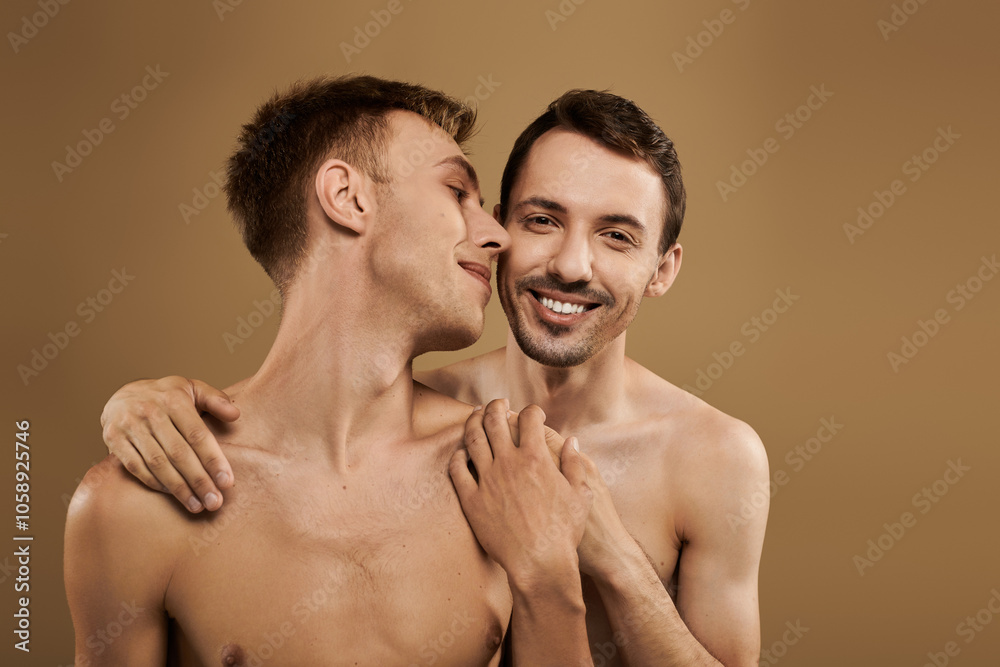 A happy young couple shares an intimate embrace, showcasing their love in a cozy atmosphere. A happy young couple shares an intimate embrace, showcasing their love in a cozy atmosphere.