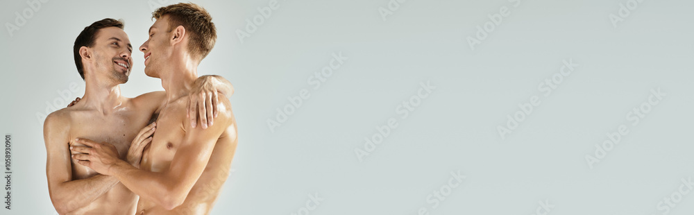 Two young men share a loving gaze while embracing in a warm and intimate moment.