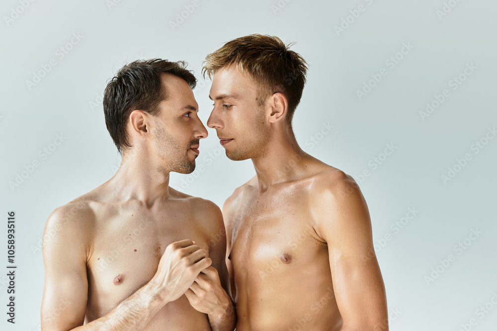 Two young men share a loving gaze, expressing deep affection in a calm setting. Two young men share a loving gaze, expressing deep affection in a calm setting.