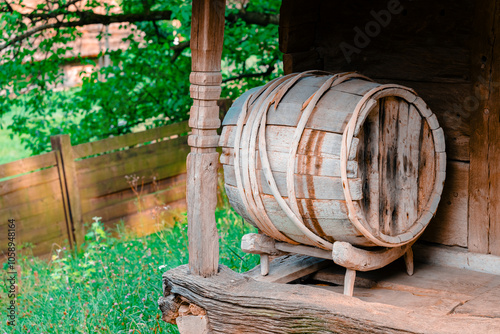 wooden barrel on a porch of rustic village house wine cellar fermenting beverage concept picture
