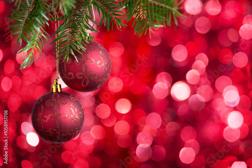 Obraz na płótnie Two Christmas tree balls on red defocused background w salonie