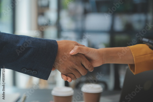 Business handshake for teamwork of business merger and acquisition,successful negotiate,hand shake,two businessman shake hand with partner to celebration partnership and business deal concept