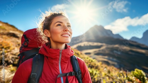 A joyful hiker gazes at the mountains, basking in sunlight, embodying adventure and nature.