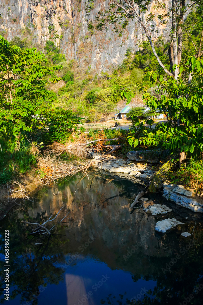 Calm river surrounded by mountains in the afternoon Calm river surrounded by mountains in the afternoon