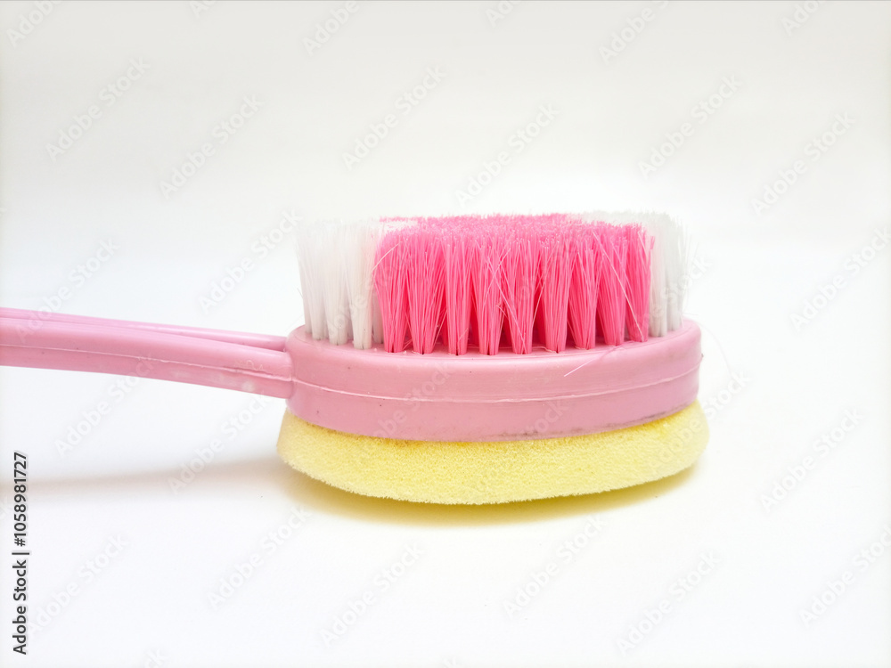 Bath brush and sponge made of plastic on white background, closeup, hygiene care shower brush with handle Bath brush and sponge made of plastic on white background, closeup, hygiene care shower brush with handle