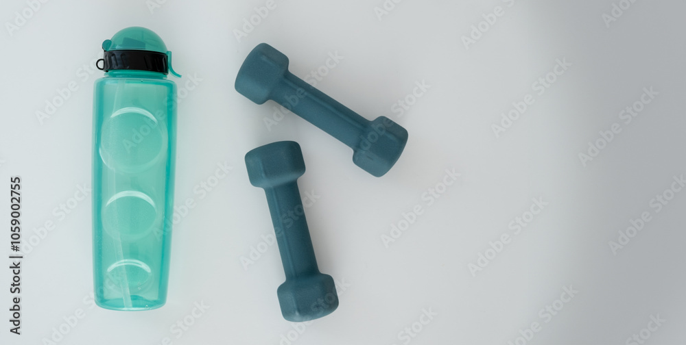 fitness equipment, kettlebells and a drinking bottle on a white background fitness equipment, kettlebells and a drinking bottle on a white background