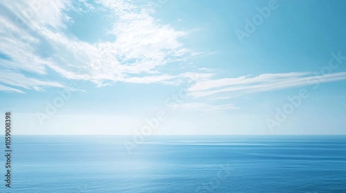 A serene and vast expanse of the blue ocean stretching towards a clear blue sky with wispy white clouds. Generative ai